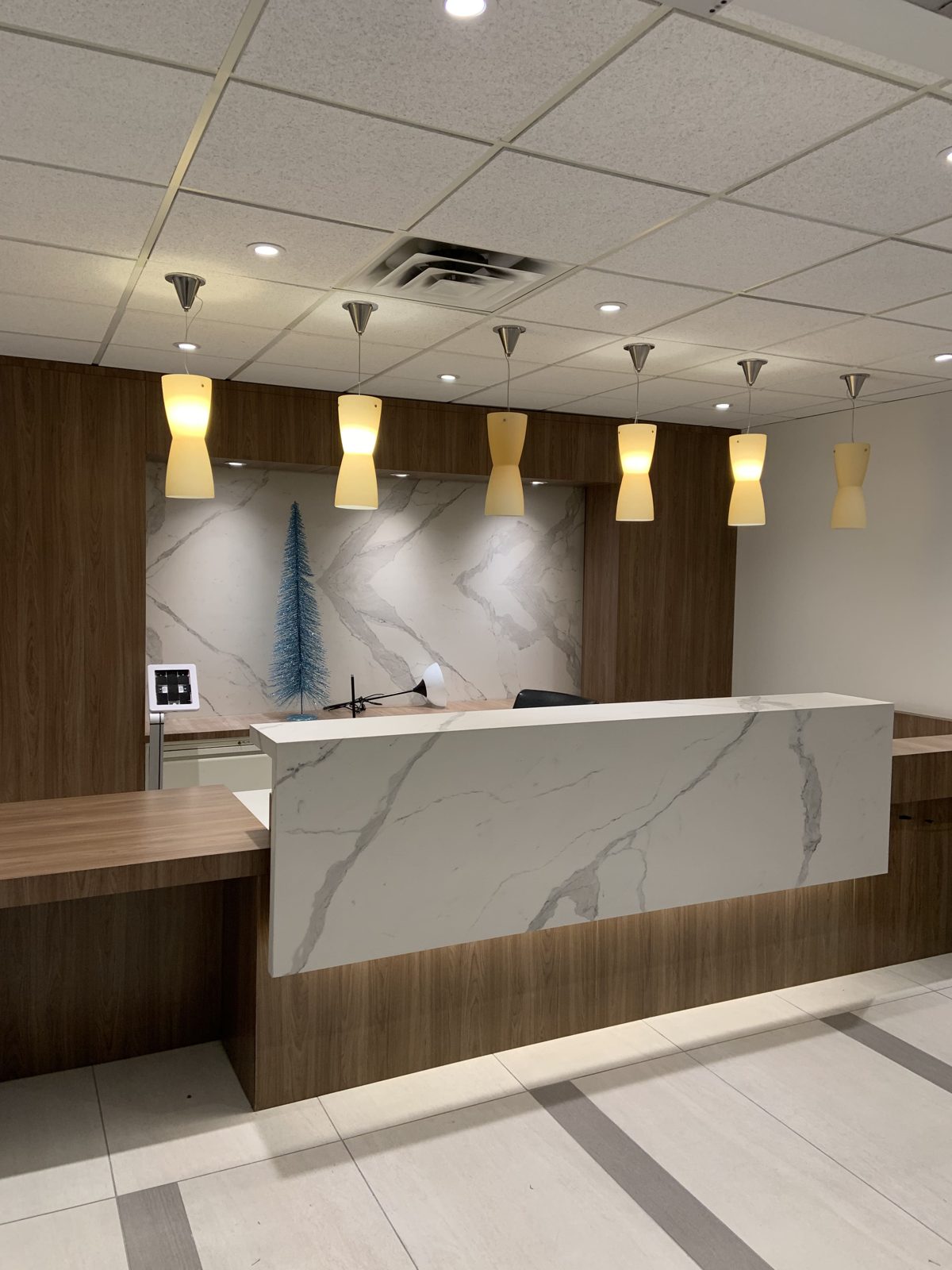 Finished office reception desk and lobby after the relocation was completed